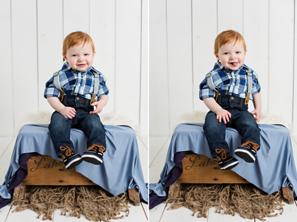 Baby boy sitter session with suspenders and blue plaid shirt on white wood background.