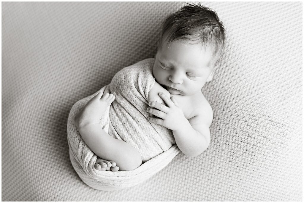 Newborn Wrap Pose in black and white | CB Studio, LLC Iowa Photographer | Nude wrap and background