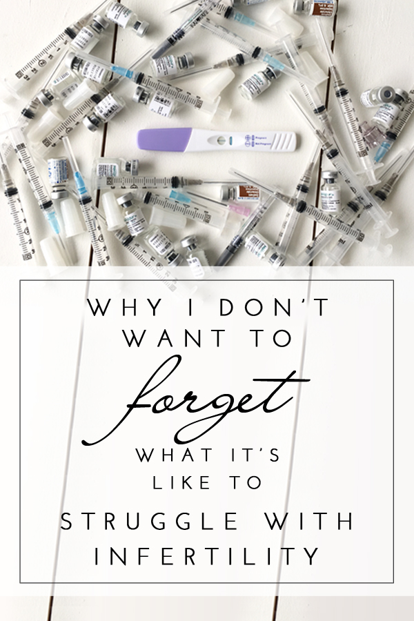 IVF needles and medication surrounding a negative pregnancy test. Why I don't want to forget what it's like to struggle with infertility.