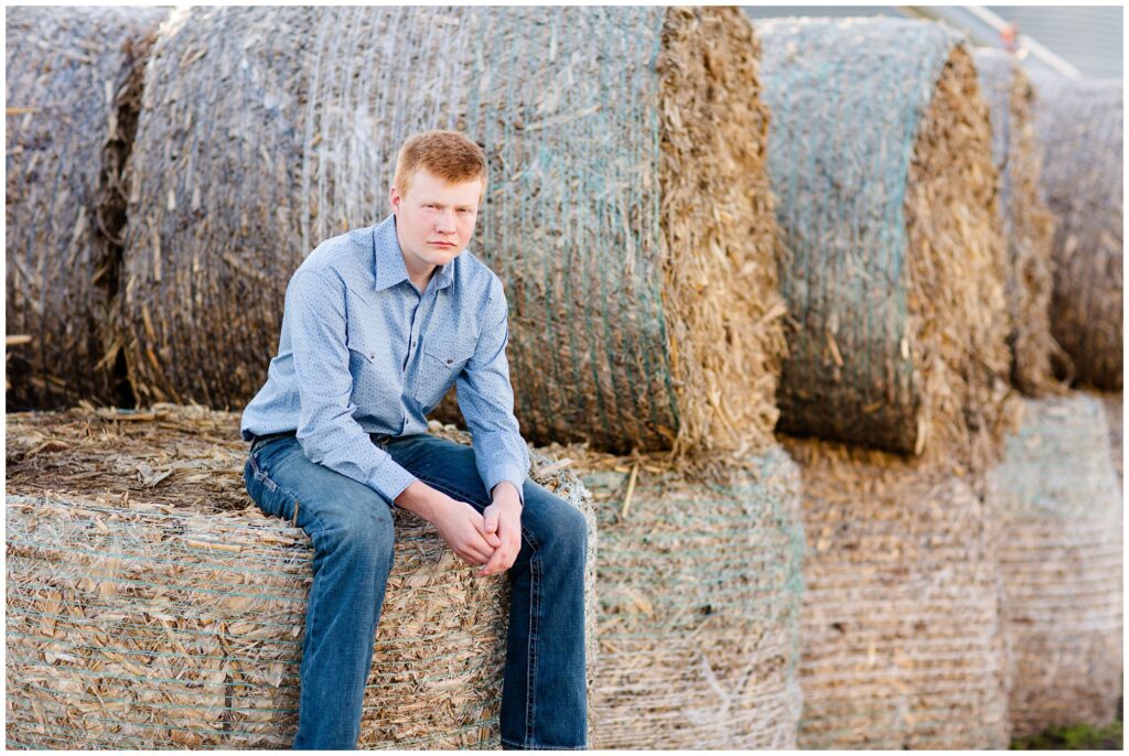 Senior photo on hay bales | Iowa Senior Photographer | CB Studio