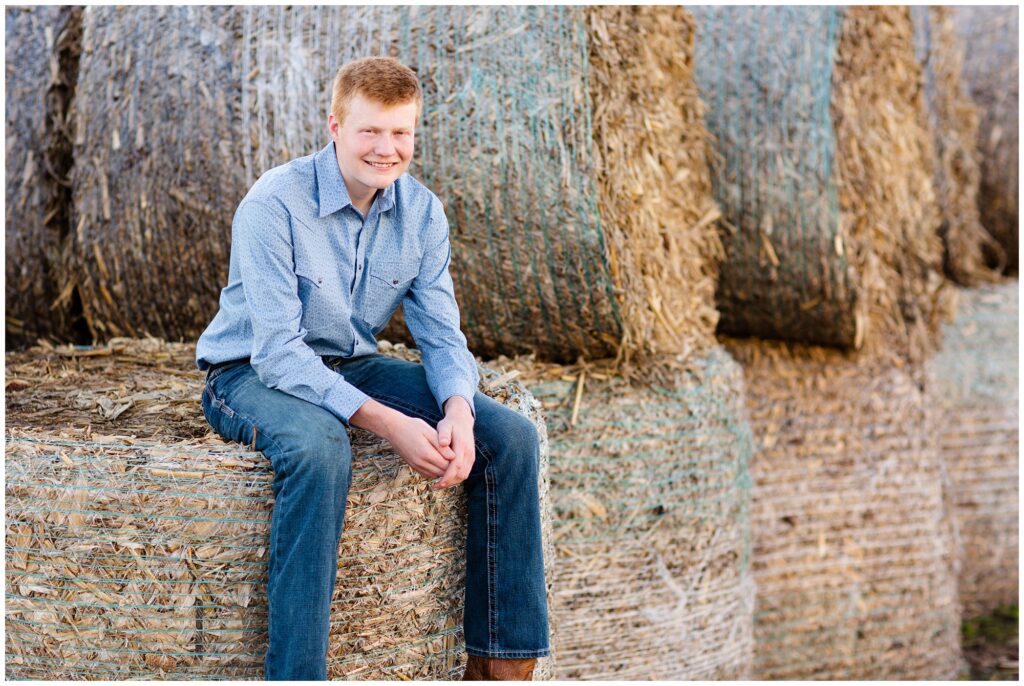 Senior photo on hay bales | Farm senior session | Iowa Senior Photographer | CB Studio