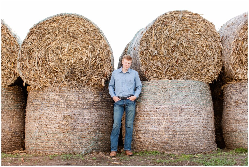 Senior photo on hay bales | Farm senior session | Iowa Senior Photographer | CB Studio