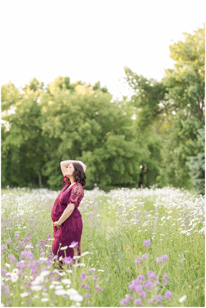 Maternity session in a flower pasture | Maternity Poses | Iowa Maternity Photographer | CB Studio