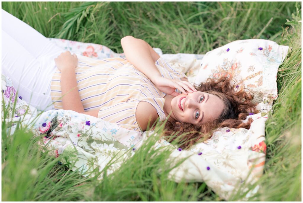 Senior photos open grassy flower field | senior poses | Iowa Senior Photographer | CB Studio