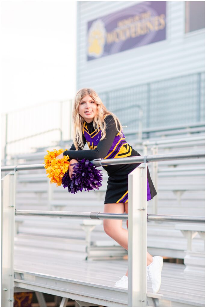 Senior portrait session at a park during golden hour | Senior girl cheerleading poses | Iowa Senior Photographer | CB Studio