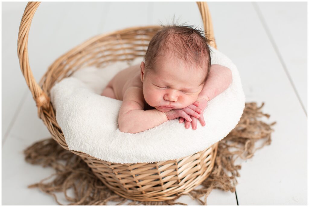 Newborn in basket pose | Iowa Newborn Photographer | CB Studio