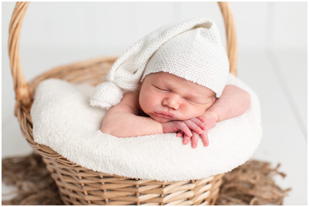 Newborn in basket pose | Iowa Newborn Photographer | CB Studio