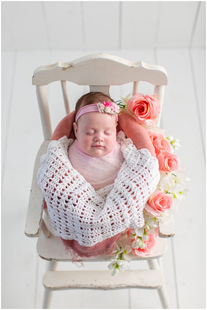 Baby pose with pink wrap and florals in a bucket | Iowa Newborn Photographer | CB Studio
