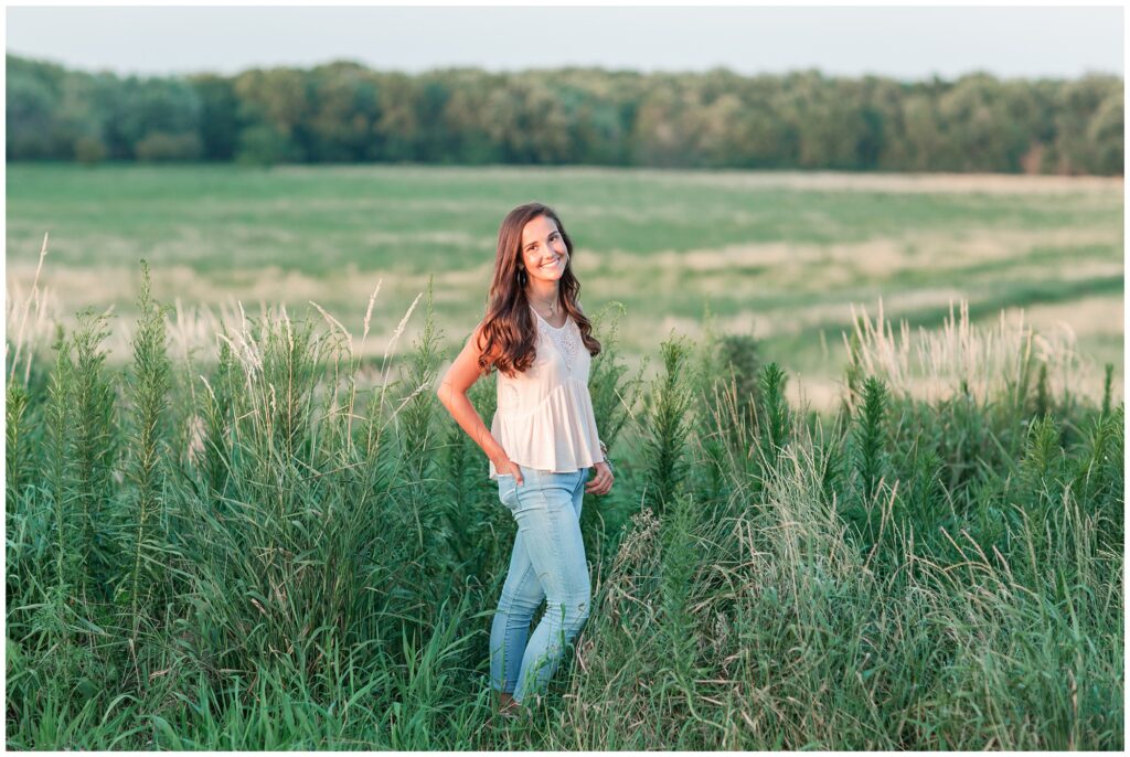 grassy field senior picture ideas | Iowa Senior Photographer | CB Studio