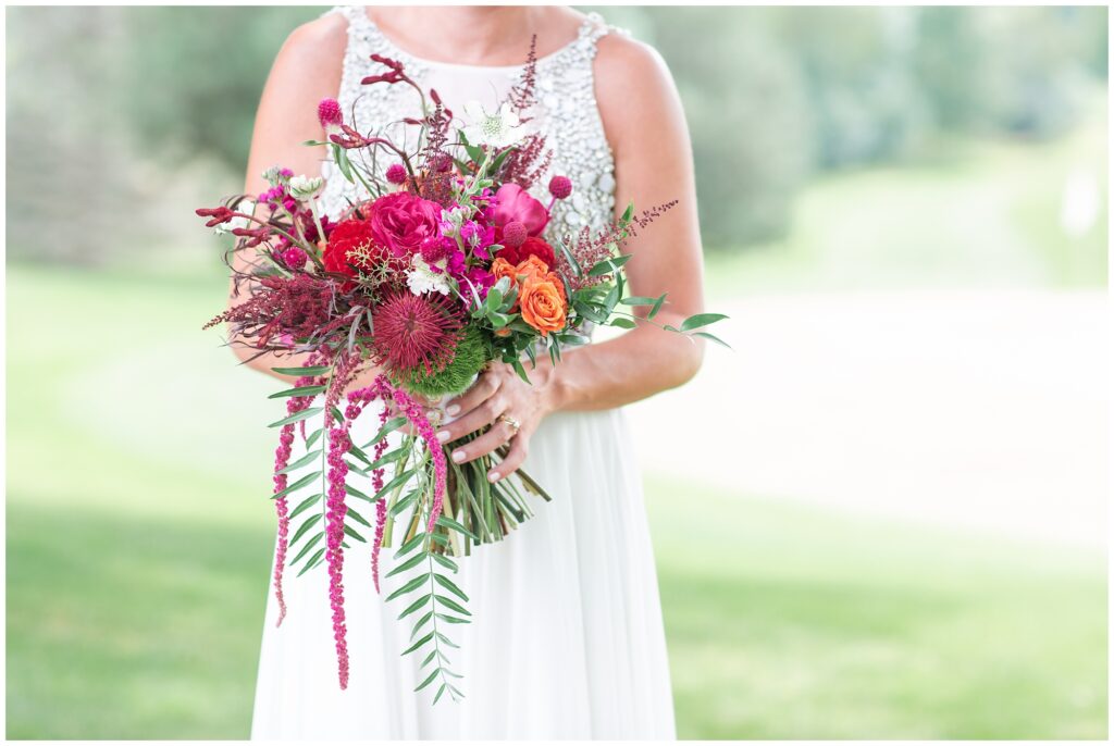 Fuchsia and pink wedding bouquet with lots of fun textures and jewel encrusted wedding dress | Iowa Wedding Photographer | CB Studio