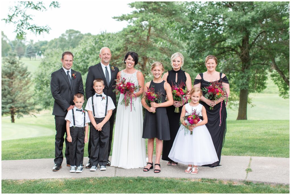 Wedding party pose on a golf course | Iowa Wedding Photographer | CB Studio