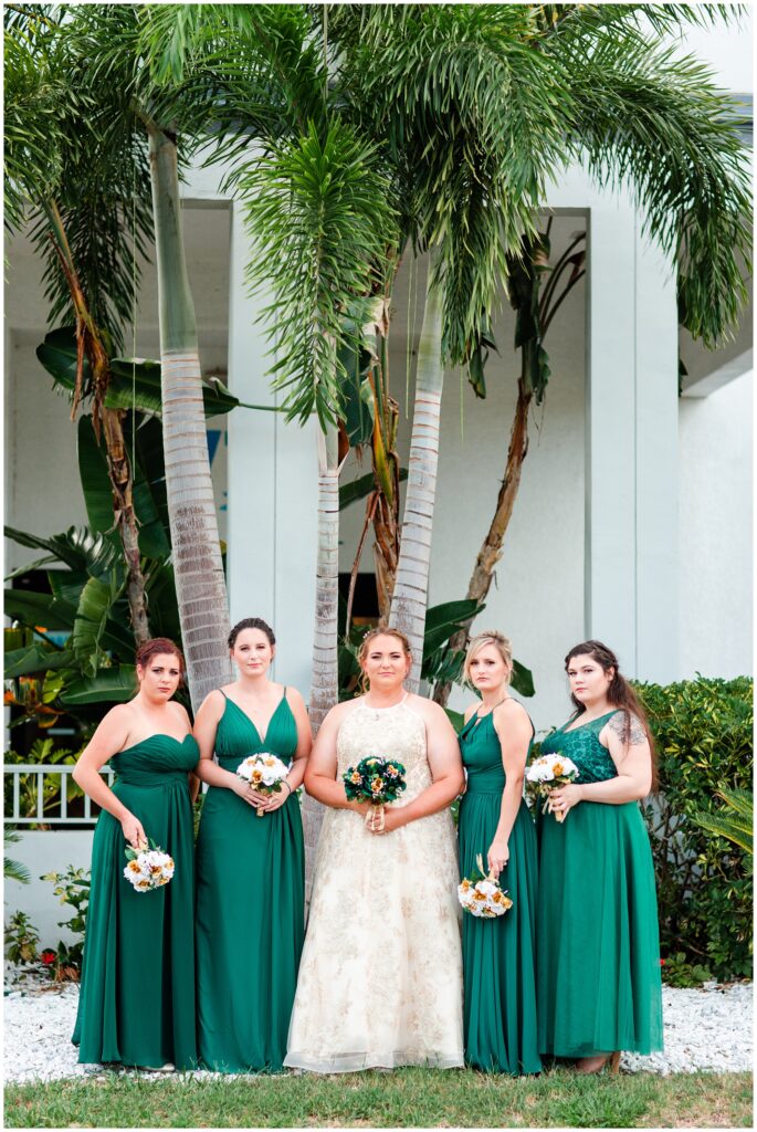 Bride and bridesmaids in green at The Godfrey Hotel Tampa | Tampa Bay Wedding | CB Studio