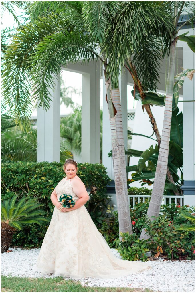 Bride posing with green and gold bouquet at The Godfrey Hotel Tampa | Tampa Bay Wedding | CB Studio