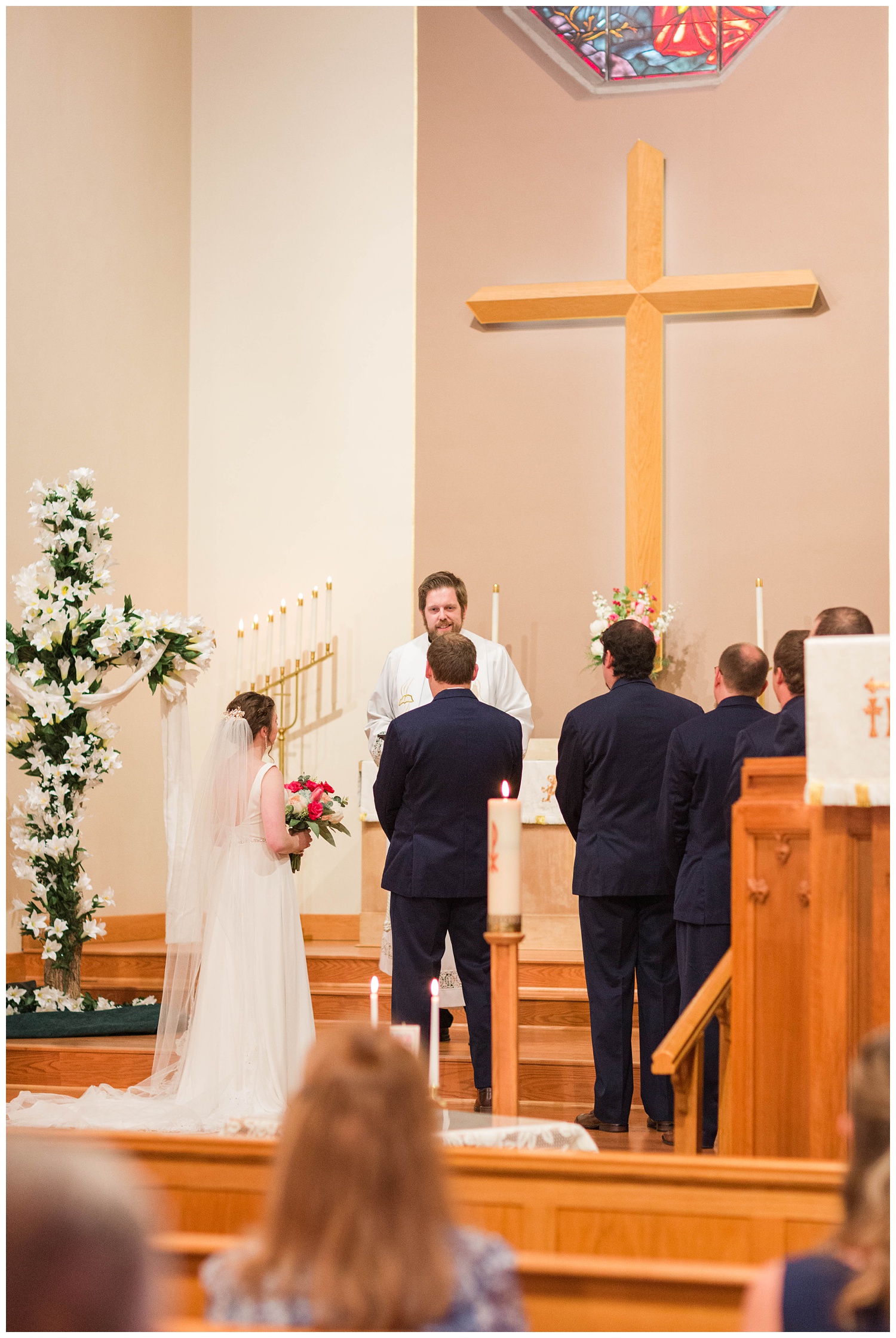 Bride and groom begin their wedding ceremony in a Lutheran church in Algona Iowa | CB Studio