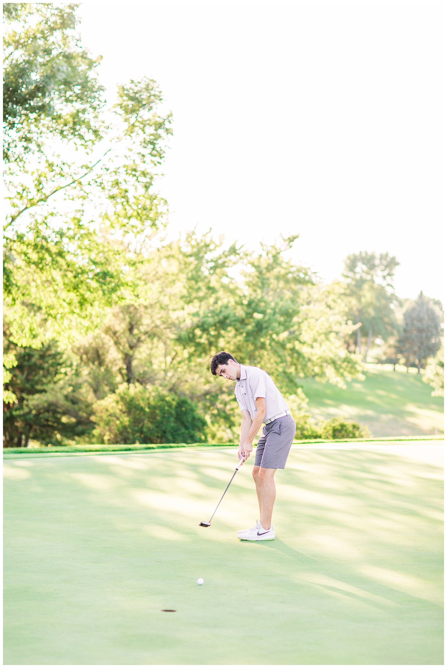 High school senior boy putting a golf ball at Spring Vally Golf Course in Livermore, Iowa | CB Studio