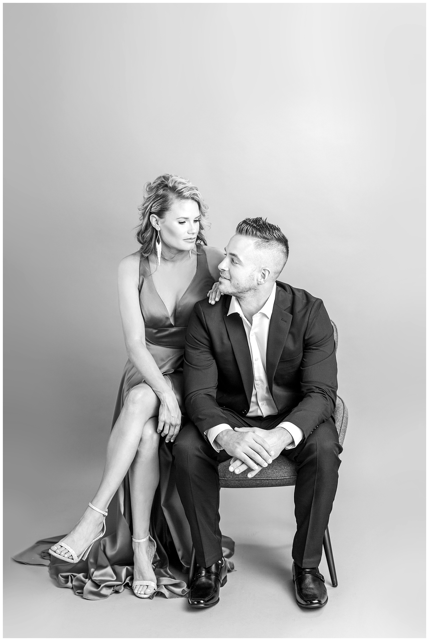 Glamorous Vanity Fair cover model couple pose in high fashion formal attire | Iowa Wedding Photographer