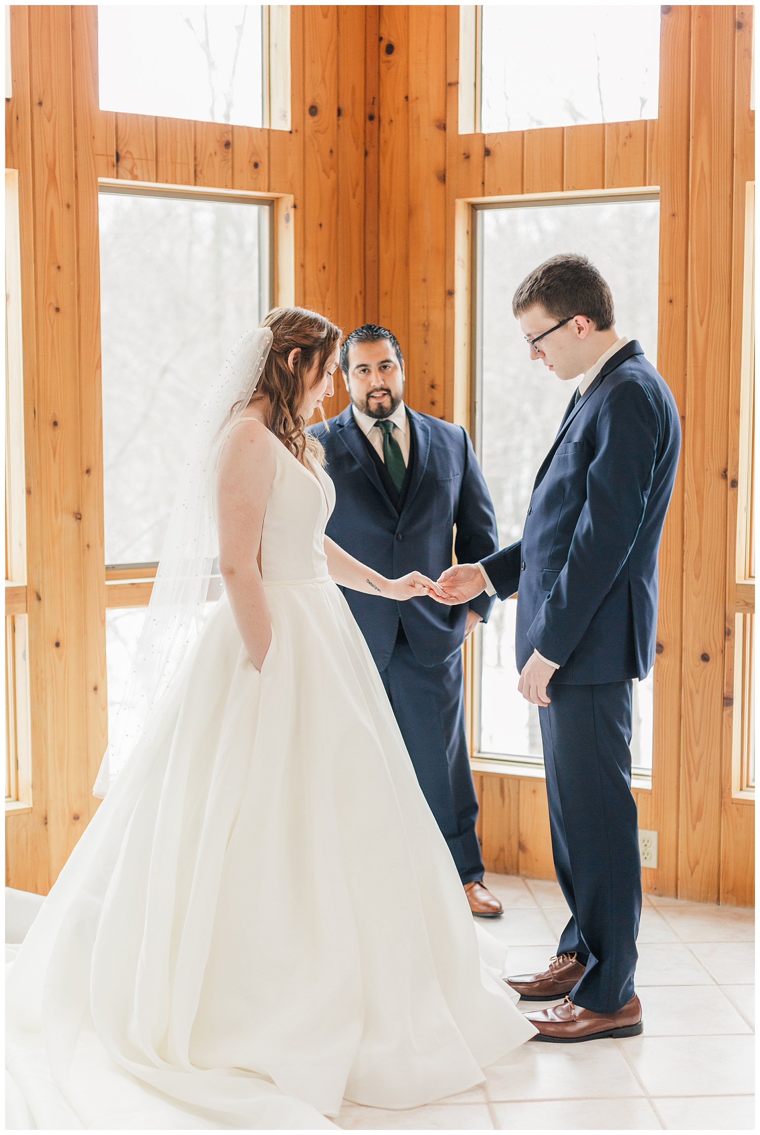 Raven and Tyler are wedded in their family's sunroom on an Iowa winter day in January | CB Studio