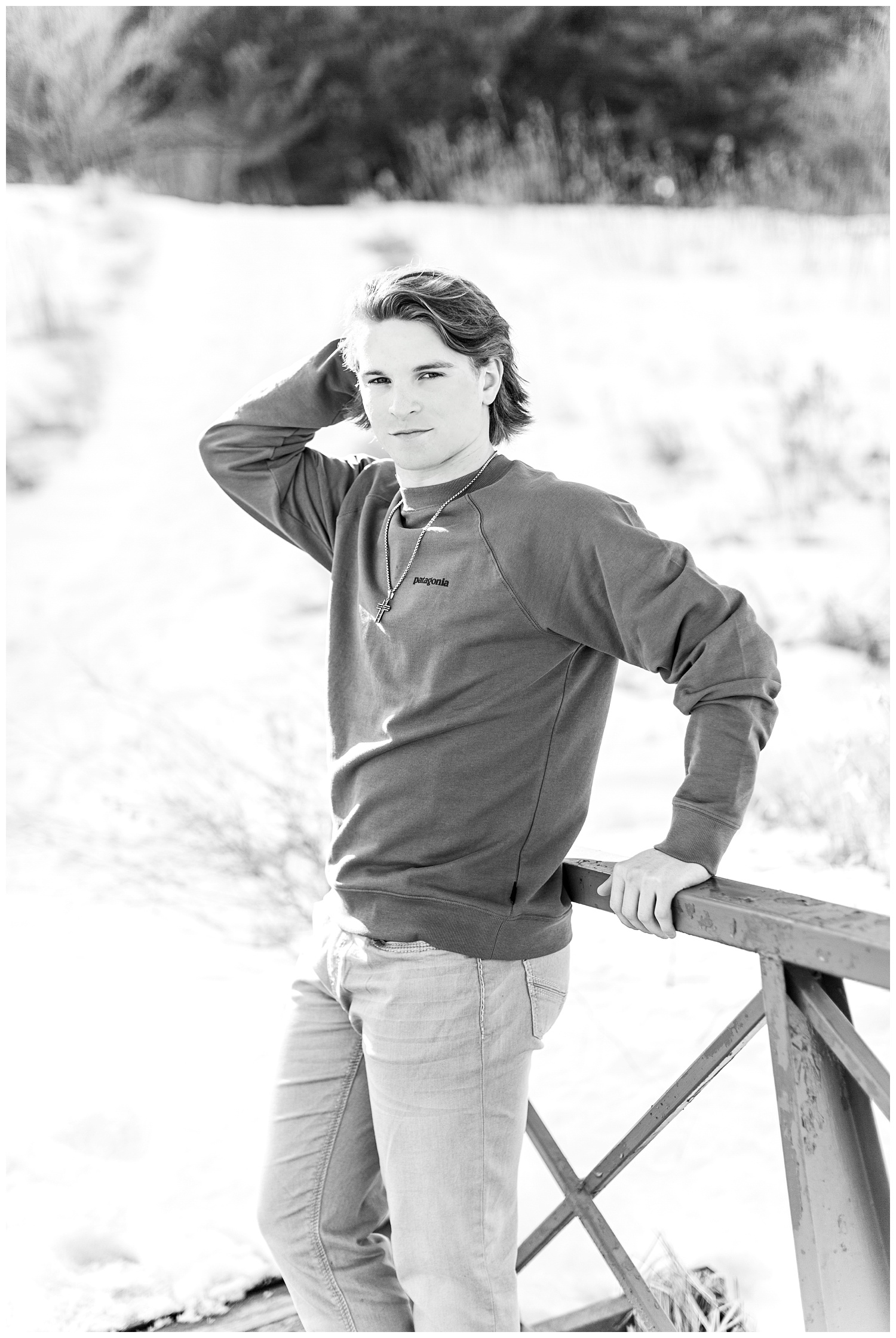 Senior Hayden wearing a Patagonia sweatshirt at Water's Edge Nature Center in Iowa | CB Studio