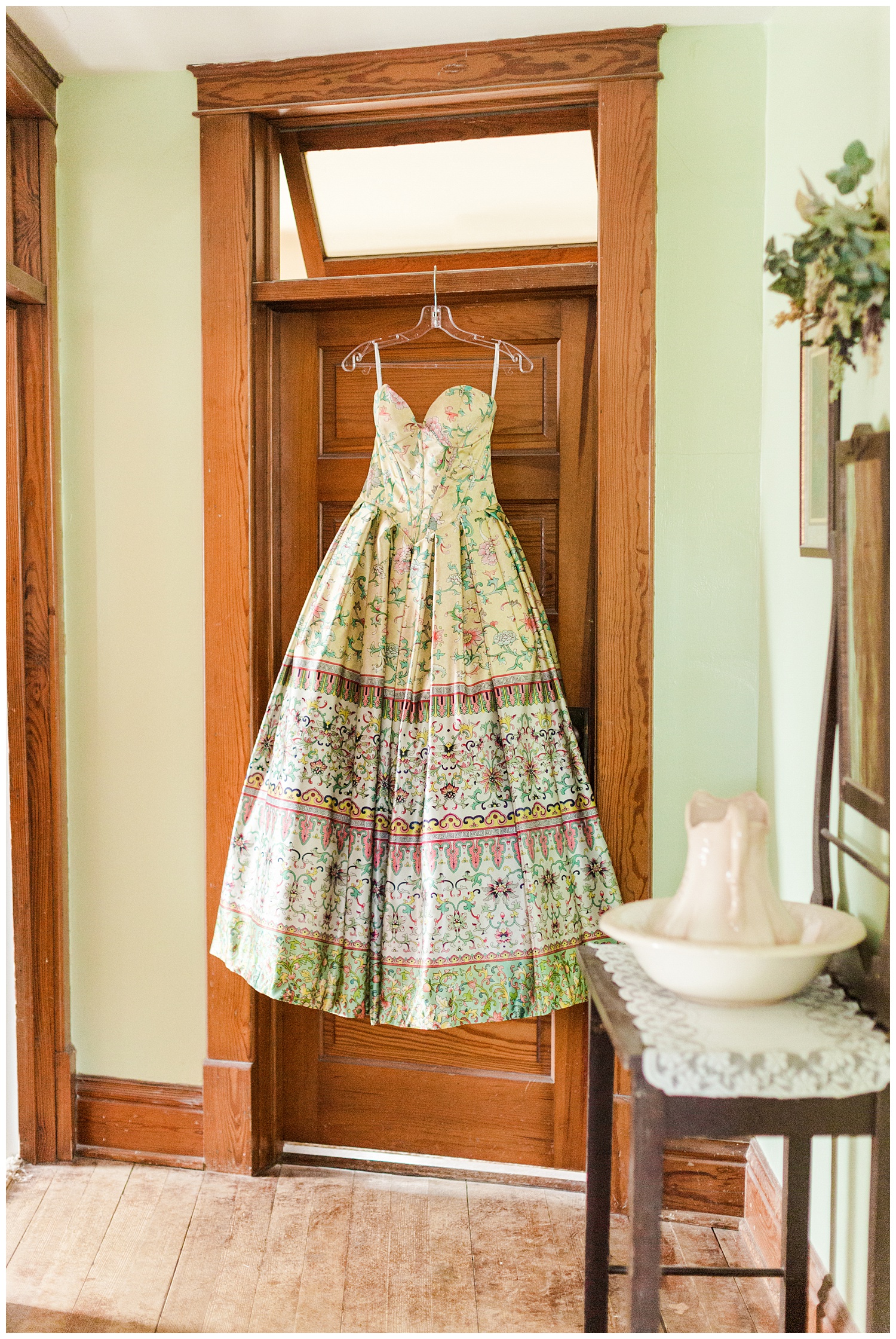 Michaela's vintage style prom dress hangs from a wooden door in an 115 year old home | CB Studio