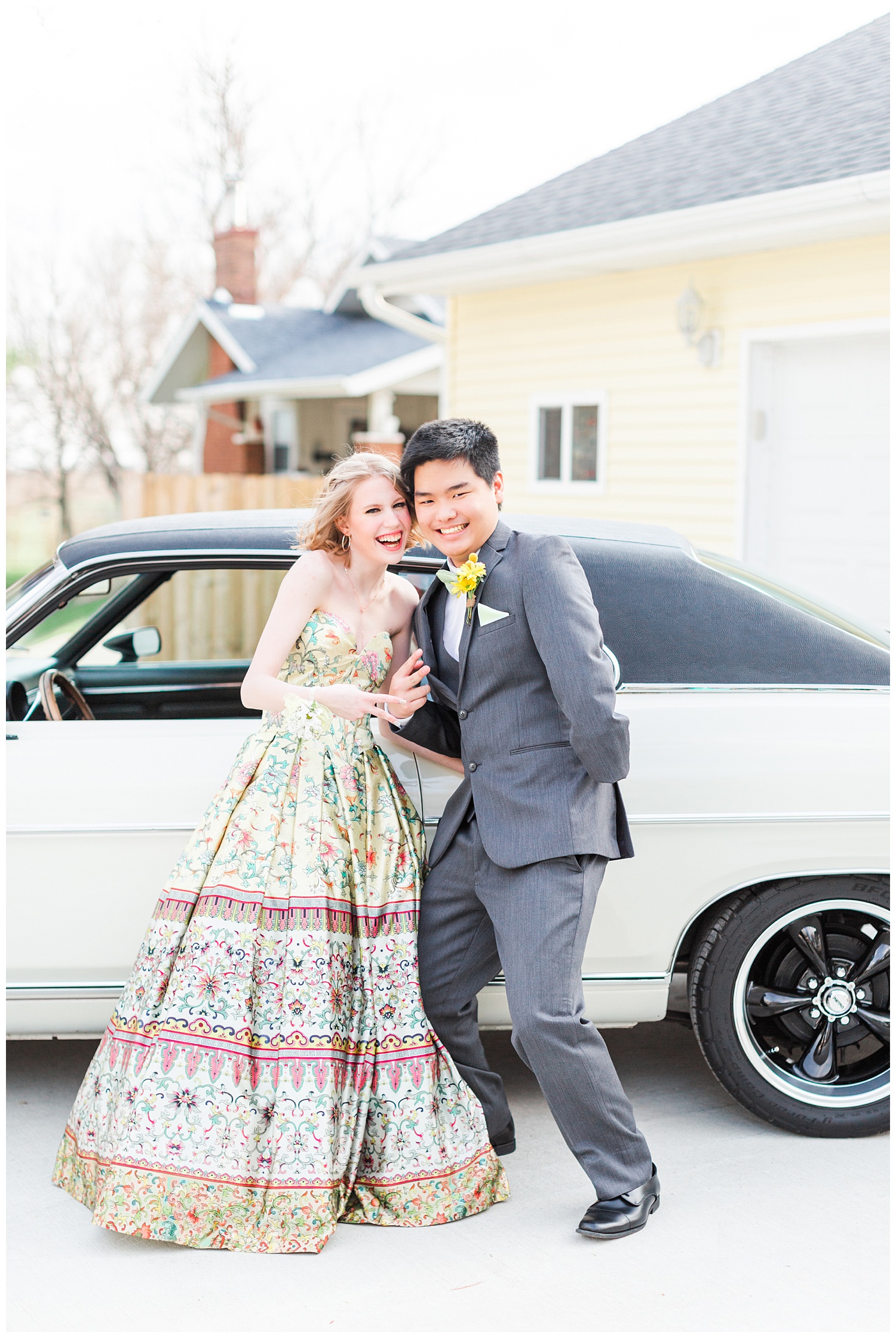 Michaela and Sam flash a peace sign as they are about to hop into a vintage and drive off to prom | CB Studio