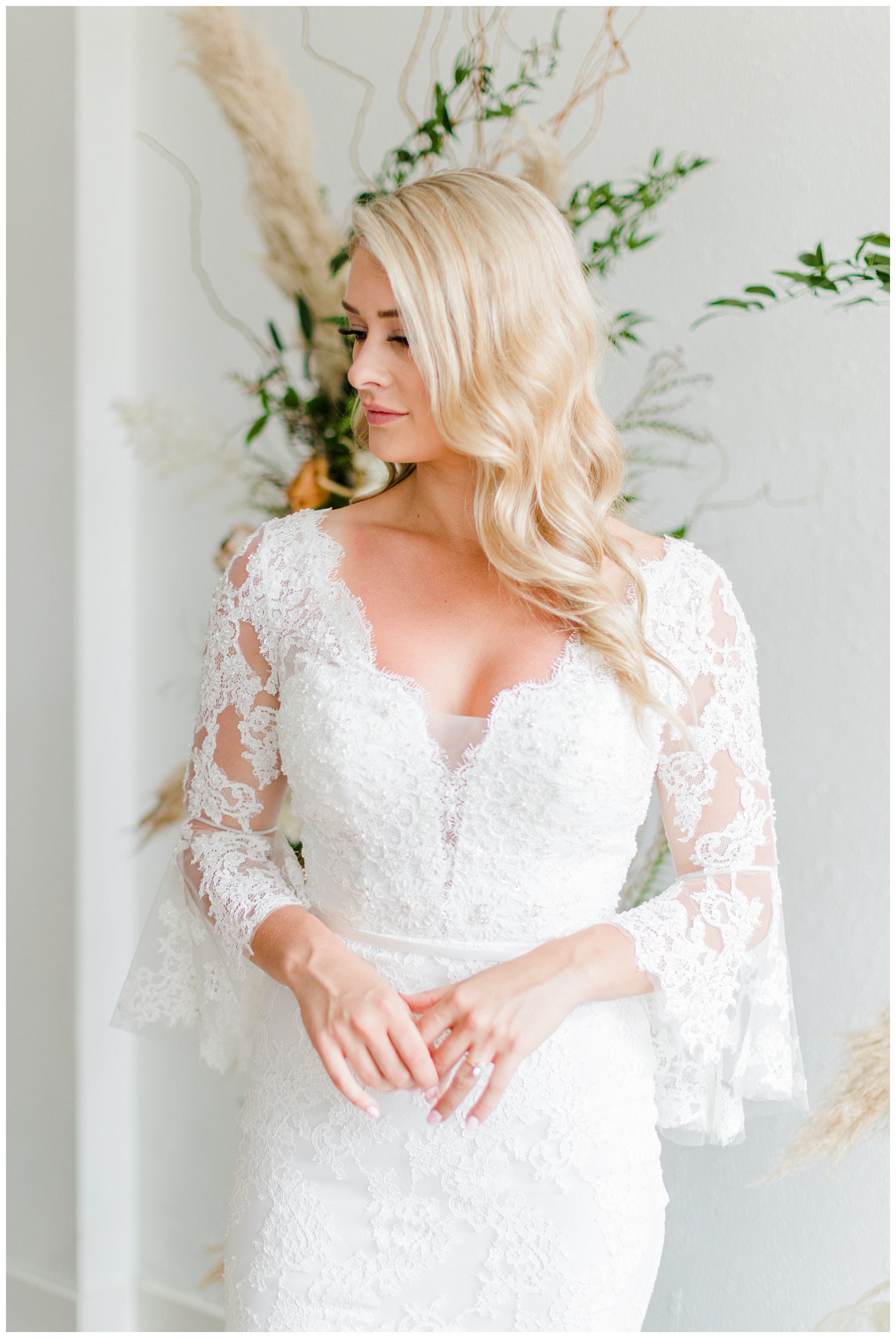Beautiful bride, Kyarsten, wearing a boho style Casablanca gown with lace elbow poet sleeves | CB Studio