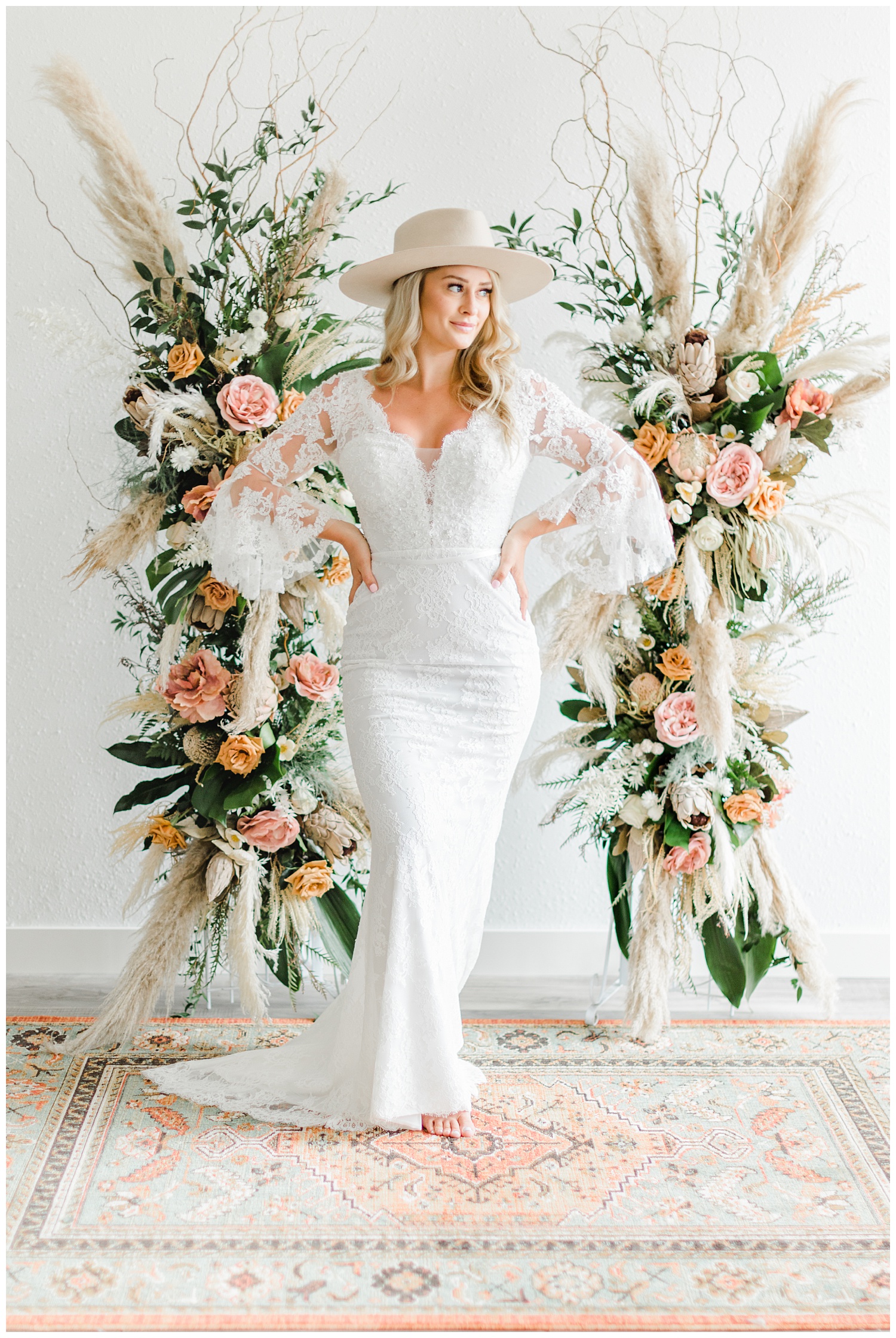 Beautiful bride, Kyarsten, wearing a boho style Casablanca gown with lace elbow poet sleeves and a Gigi Pip hat | CB Studio