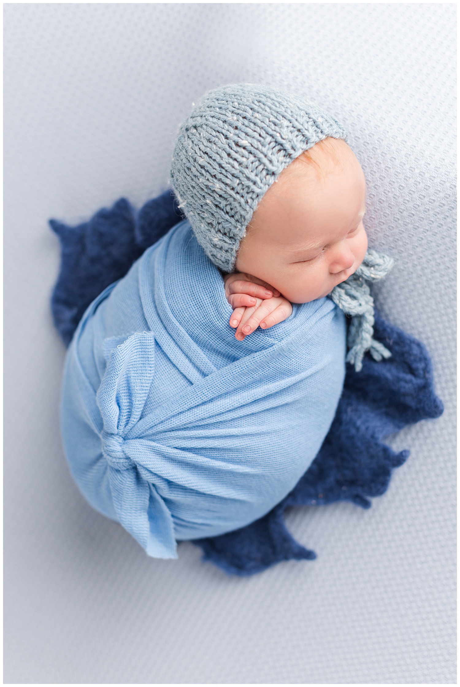 Newborn baby Luka wrapped in shades of blue | CB Studio