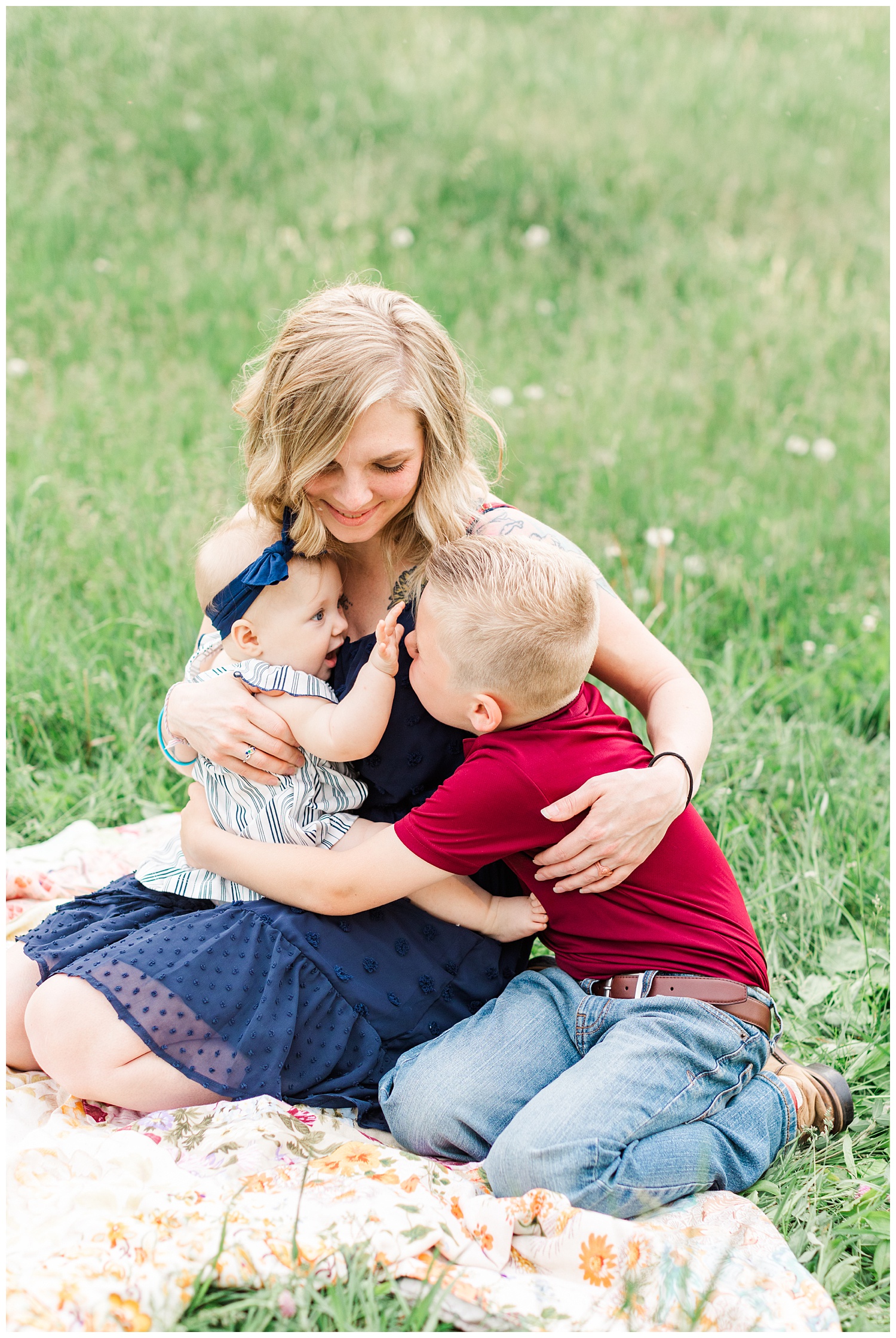 Mama embraces her two children in a grassy pasture in Iowa | CB Studio
