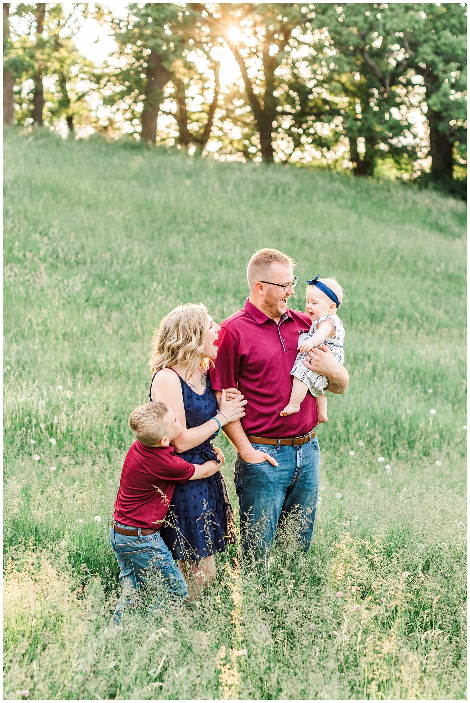 Golden hour family portraits in a grassy field with rolling hills in Iowa | CB Studio