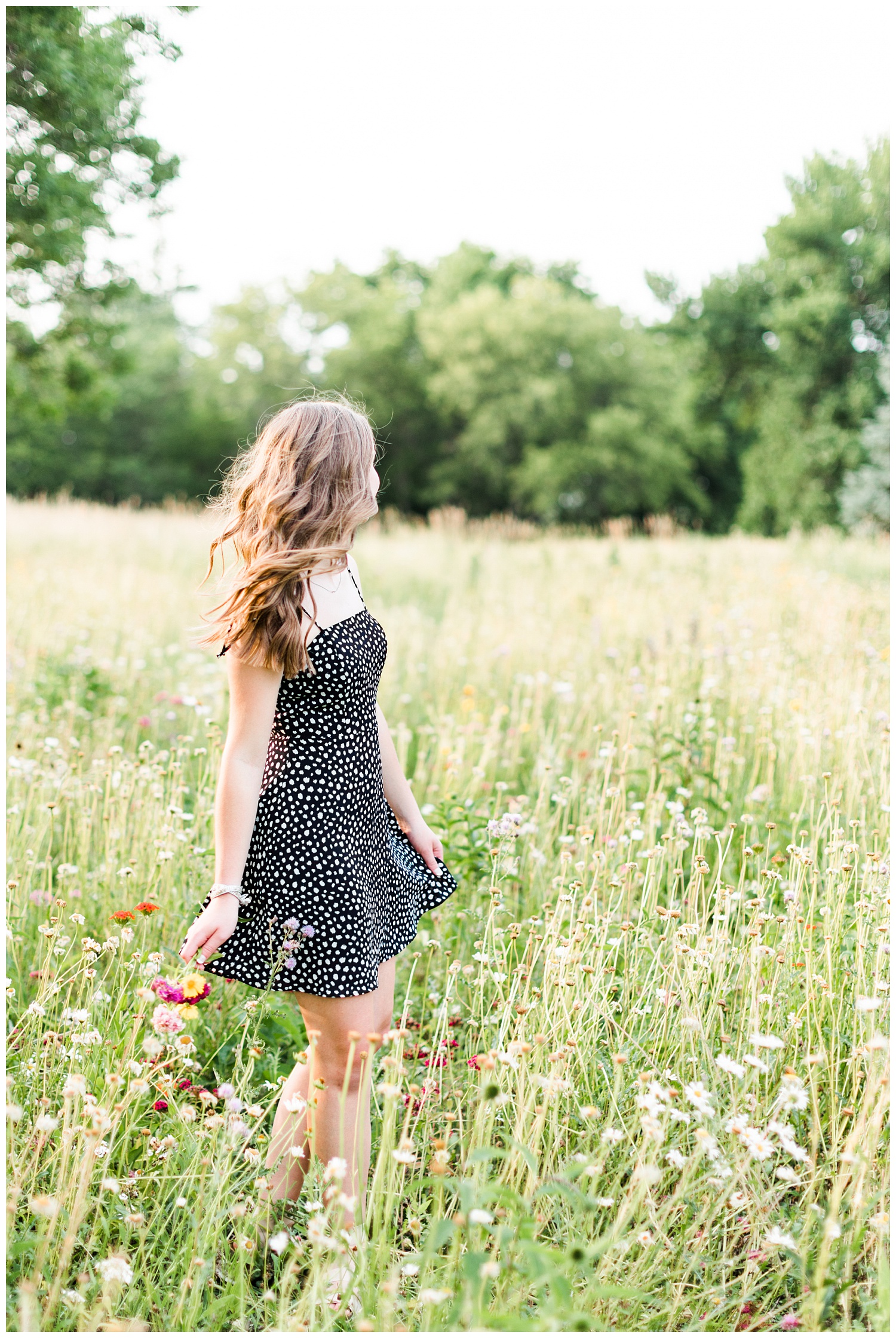 Senior Taylor dances in a field of wildflowers | CB Studio