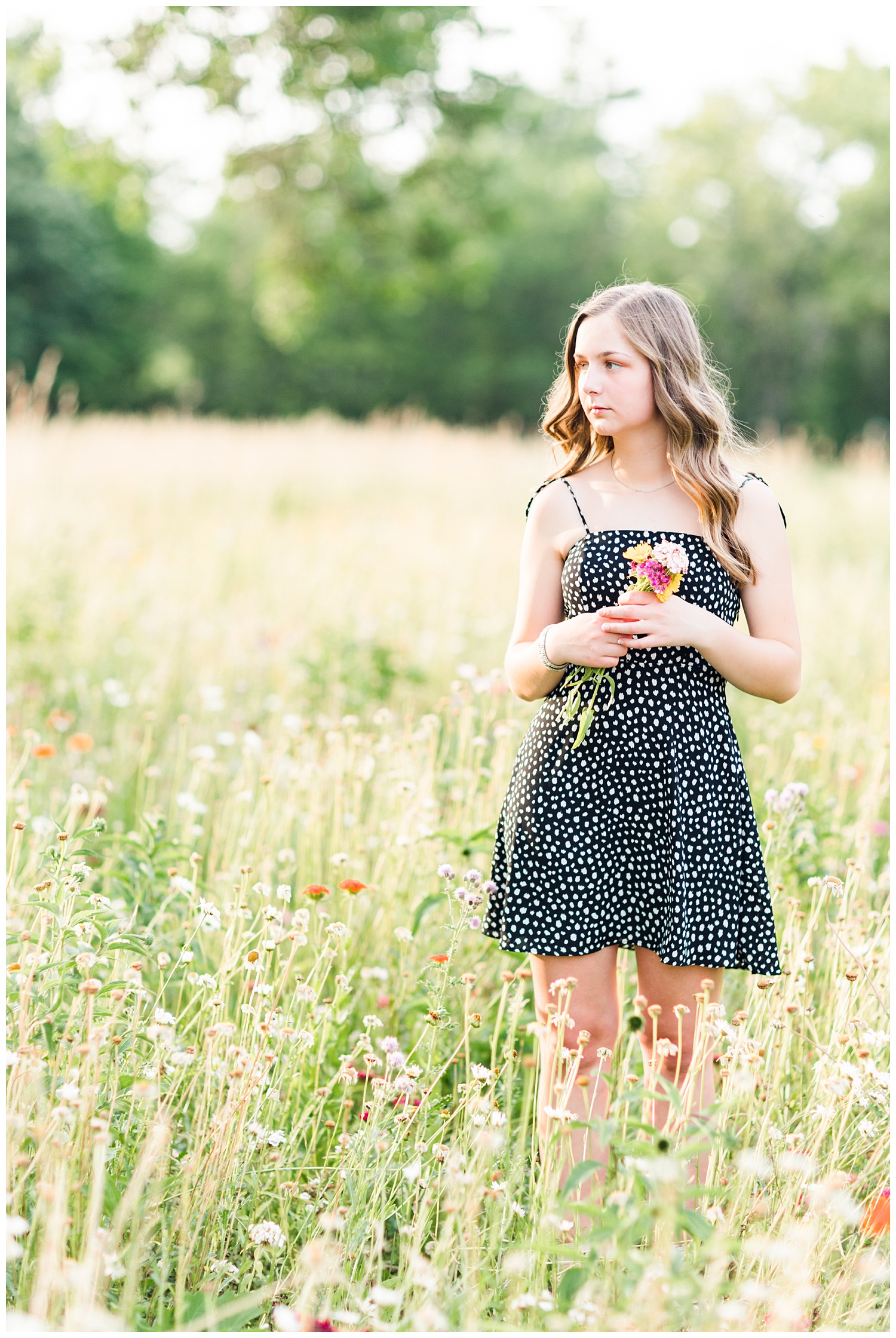 Senior Taylor stands in a field of wildflowers | CB Studio