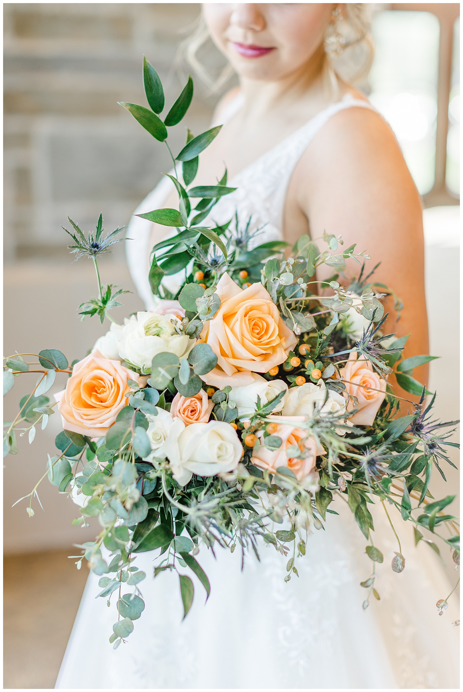 Peach and white rose wedding bouquet with white ranunculus and eucalyptus | CB Studio