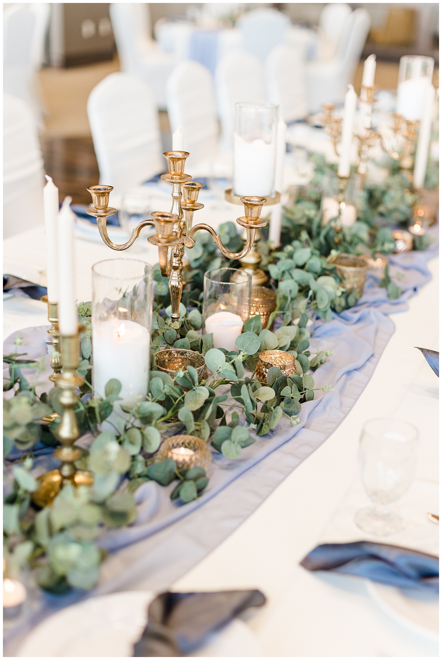 Dusty blue and peach kings wedding table topped with gold vintage candlesticks and eucalyptus at the Shores at Five Island | CB Studio