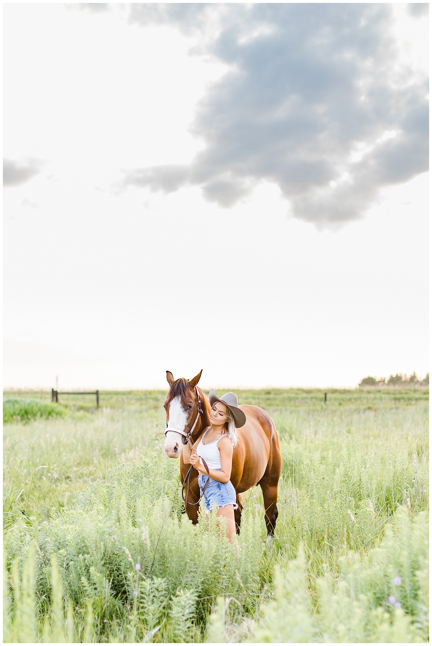 Addison snuggles Miss Flirty the horse in a grassy field | CB Studio