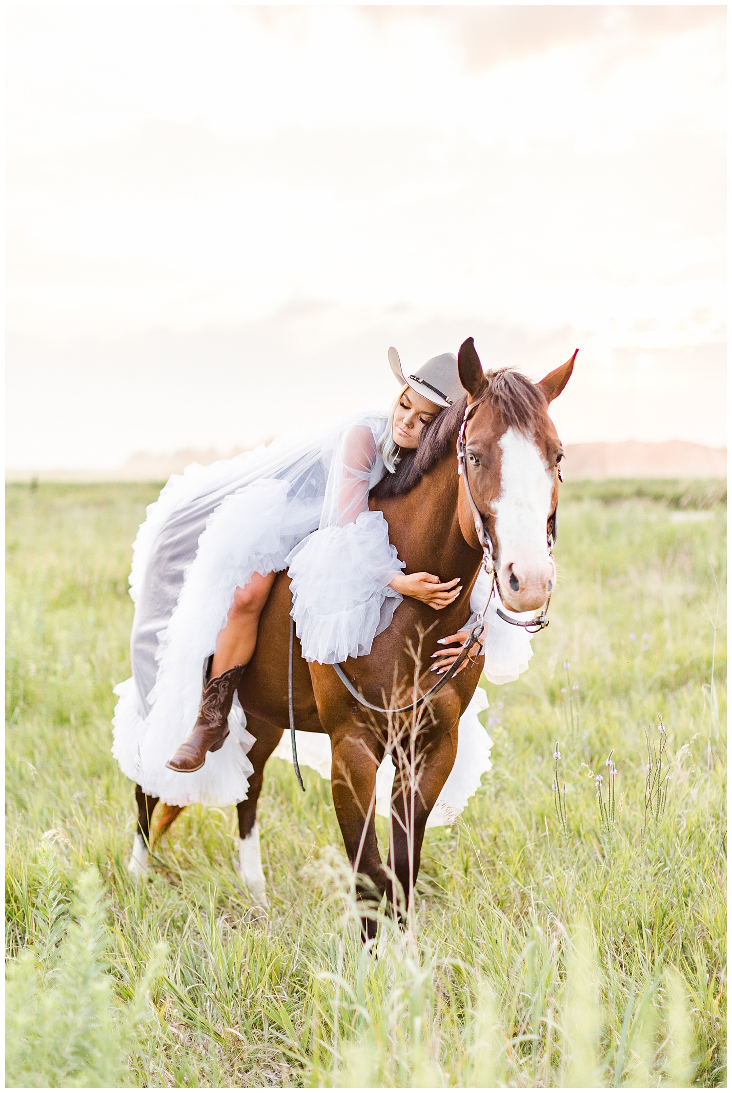Addison wearing a puffy tulle dress snuggles Miss Flirty the horse in a grassy field | CB Studio
