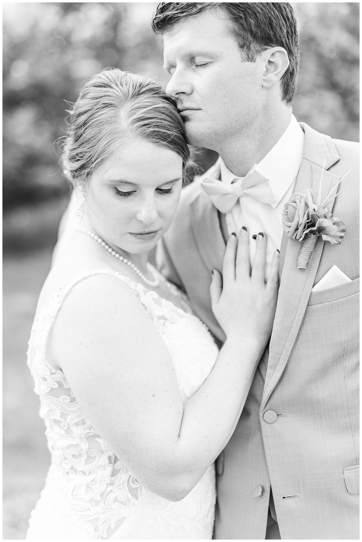 Chris and Hannah embrace each other on their wedding day in Spirit Lake Iowa | CB Studio
