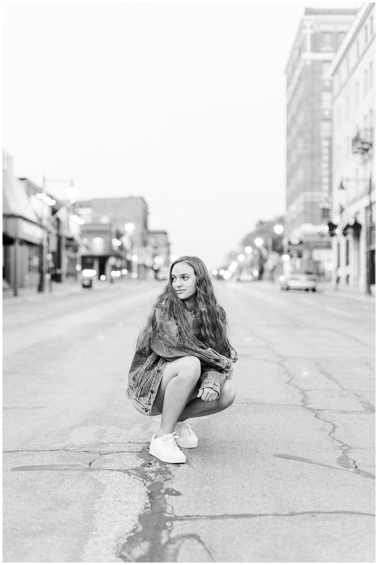 Senior Kennedy sits in the middle of the street in downtown Fort Dodge | CB Studio