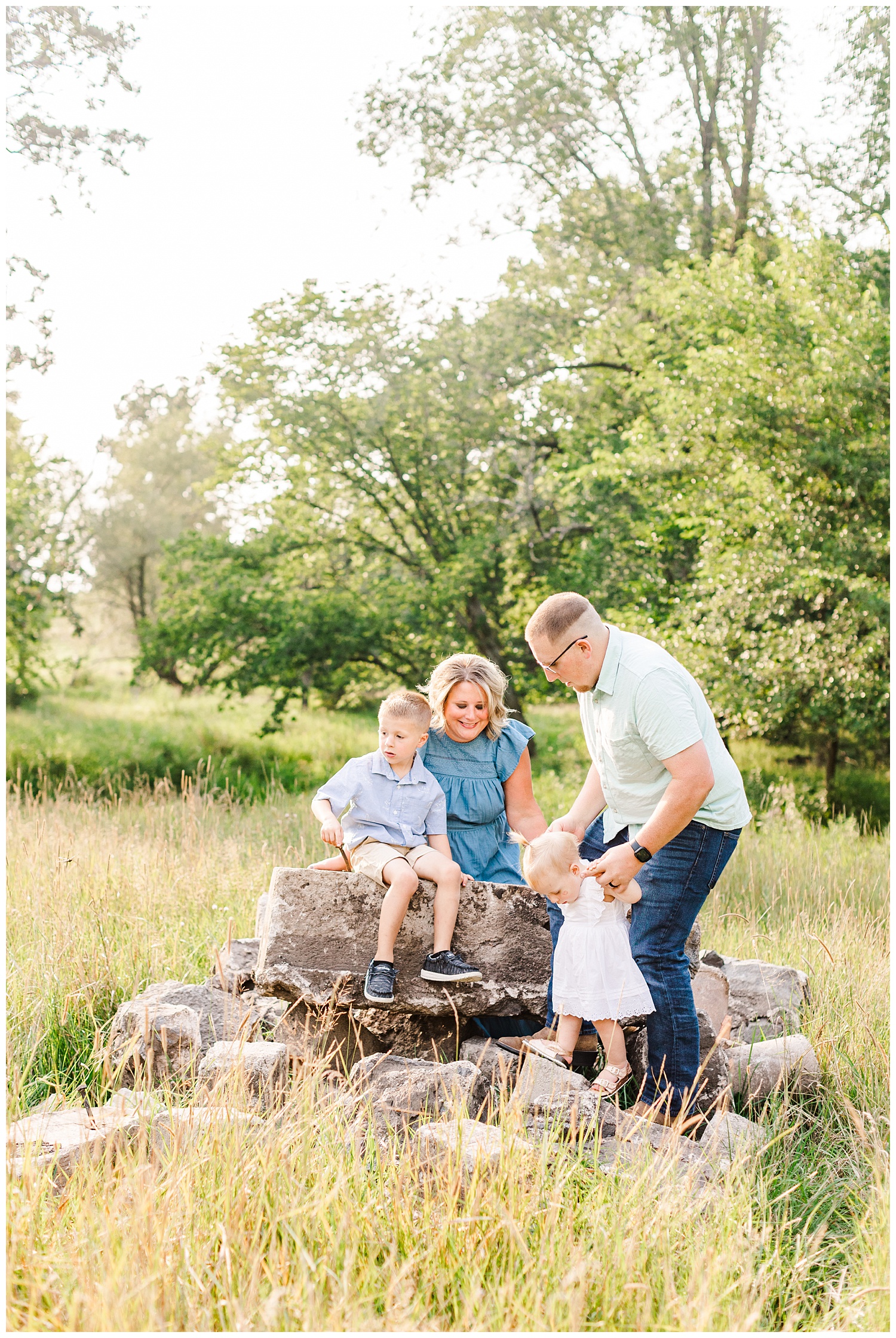 The Bruhn family play together in a grassy pasture in Iowa | CB Studio