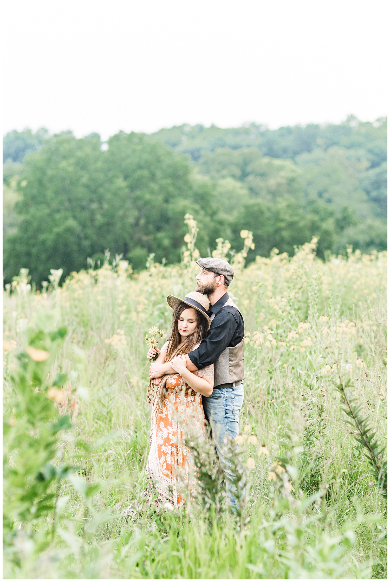 Katlyn and Brad embrace in the middle of a wildflower field at Thomas Mitchell Park | CB Studio