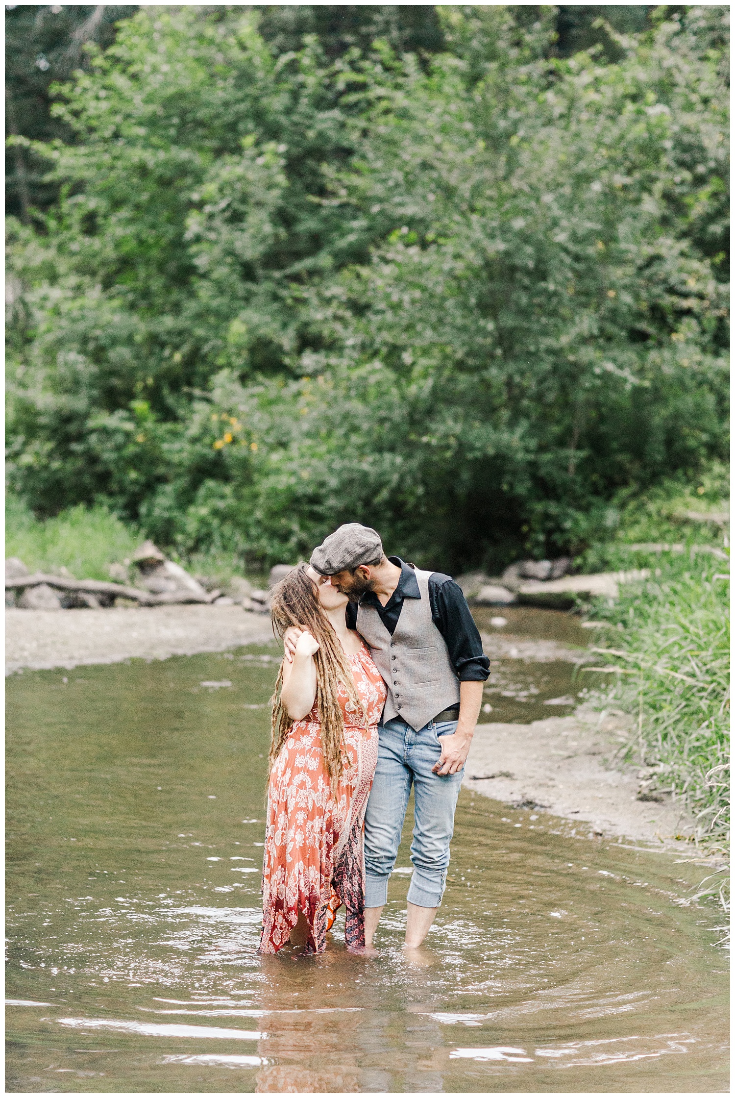 Katlyn and Brad kiss in the middle of a stream at Thomas Mitchell Park | CB Studio