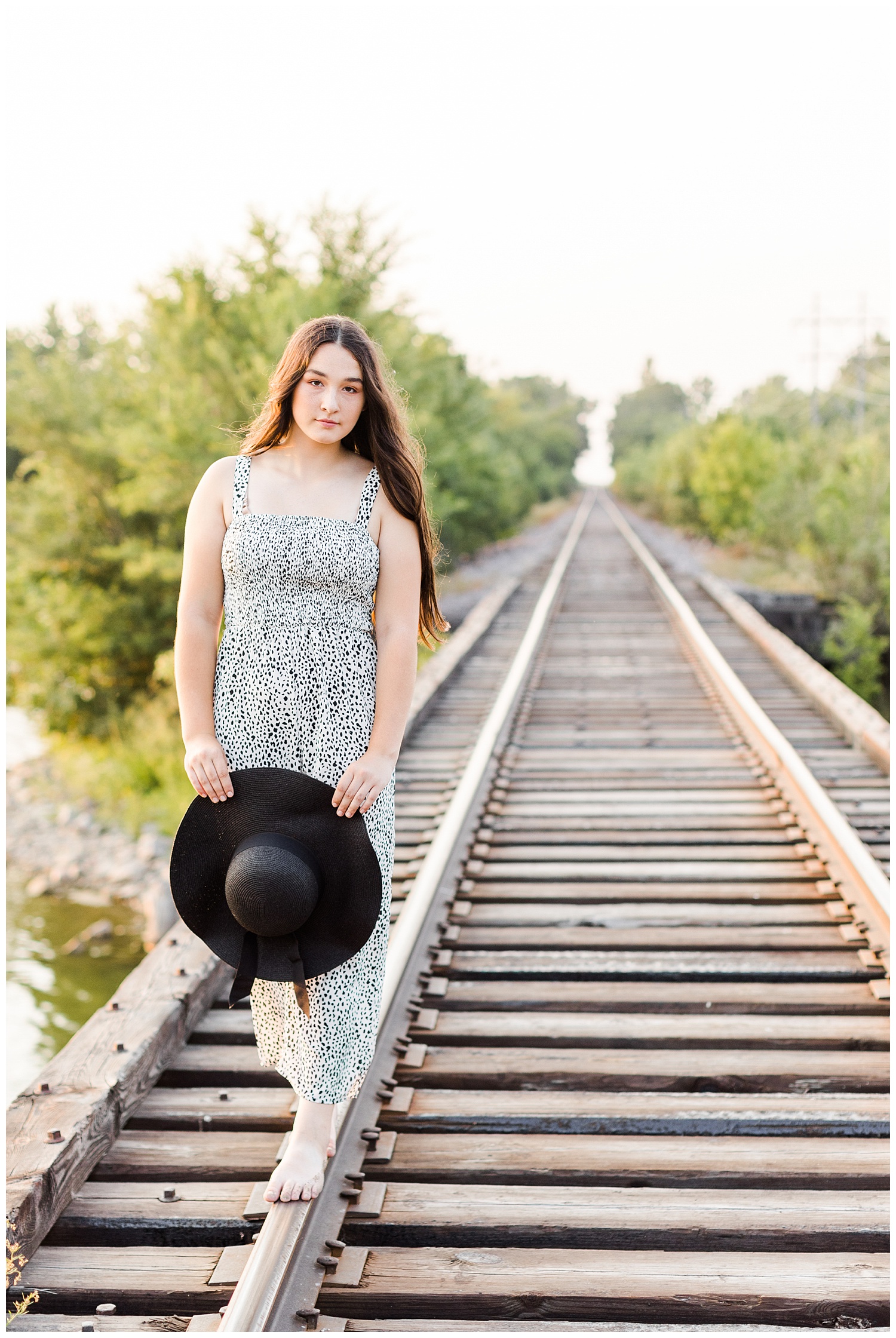 Laney walks slowly along a railroad track | CB Studio