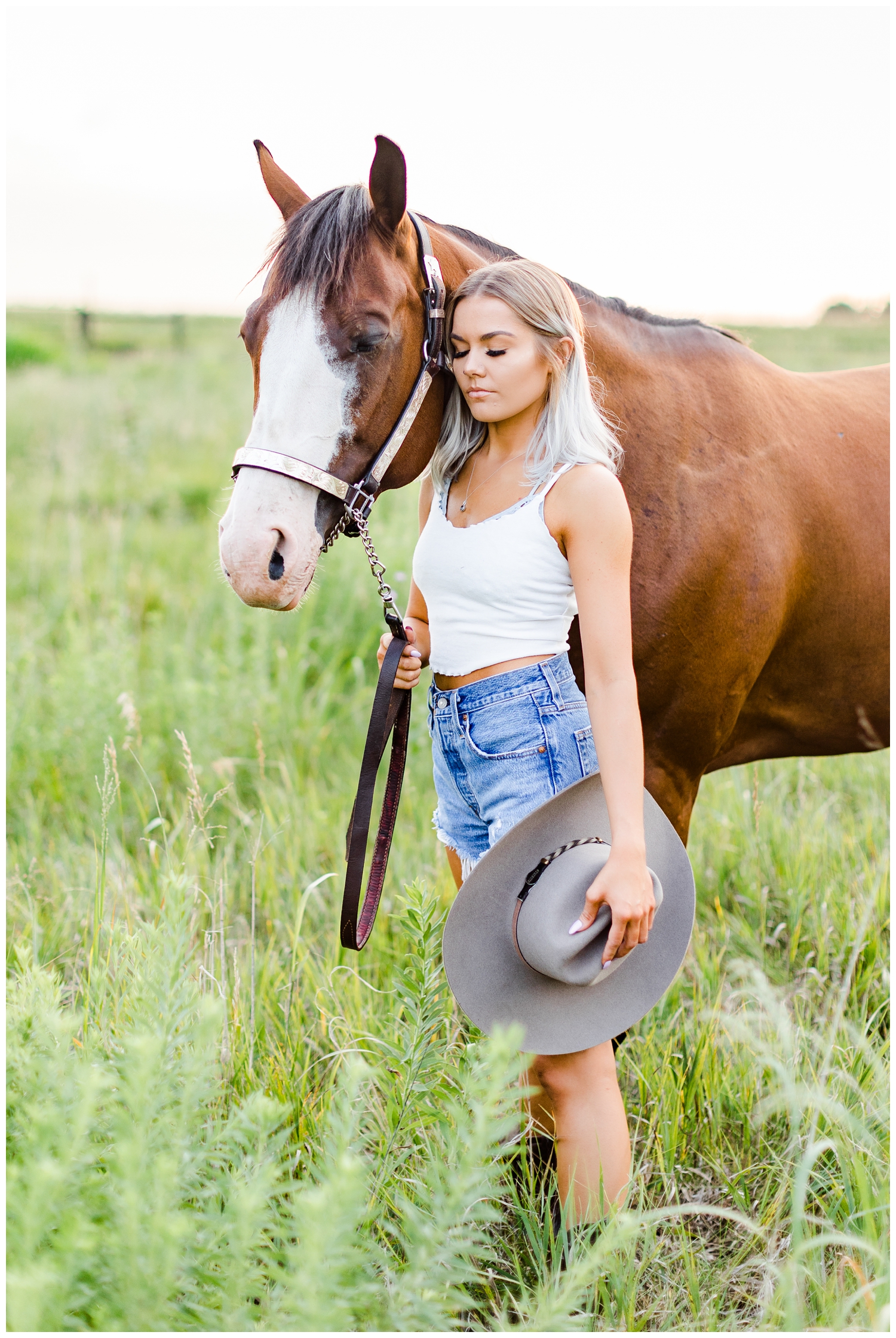 Addison snuggles her horse in a grassy field | CB Studio