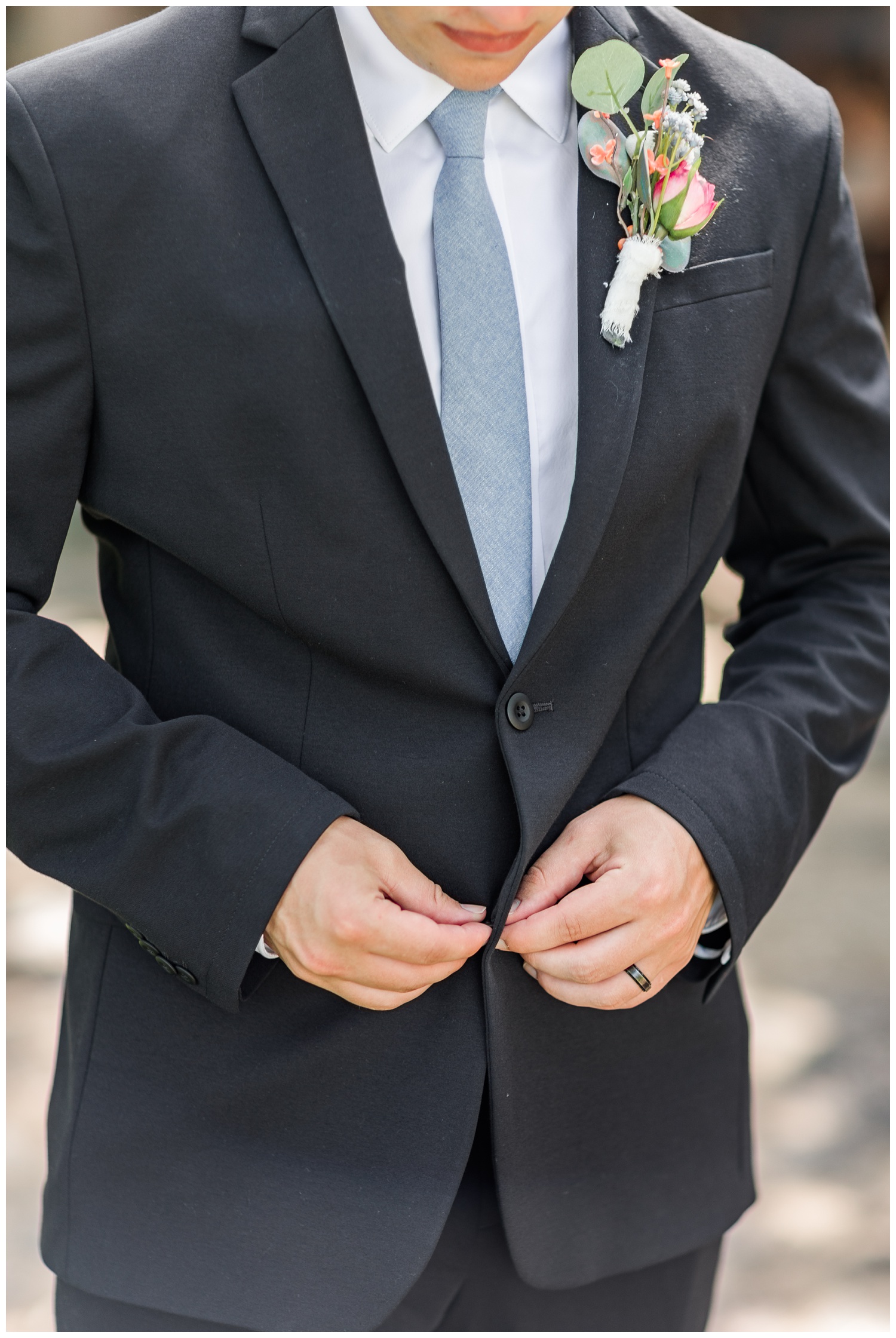Thad buttons his tux jacket as he waits to meet his bride | CB Studio