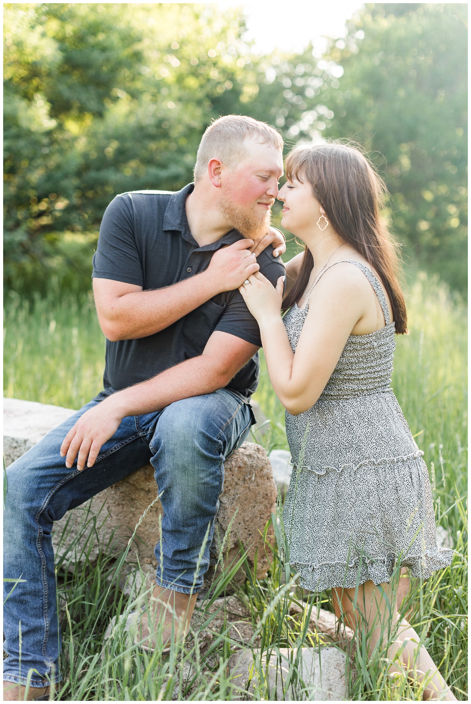 Jeremiah and Madeline share eskimo kisses in a grassy pasture in Iowa | CB Studio