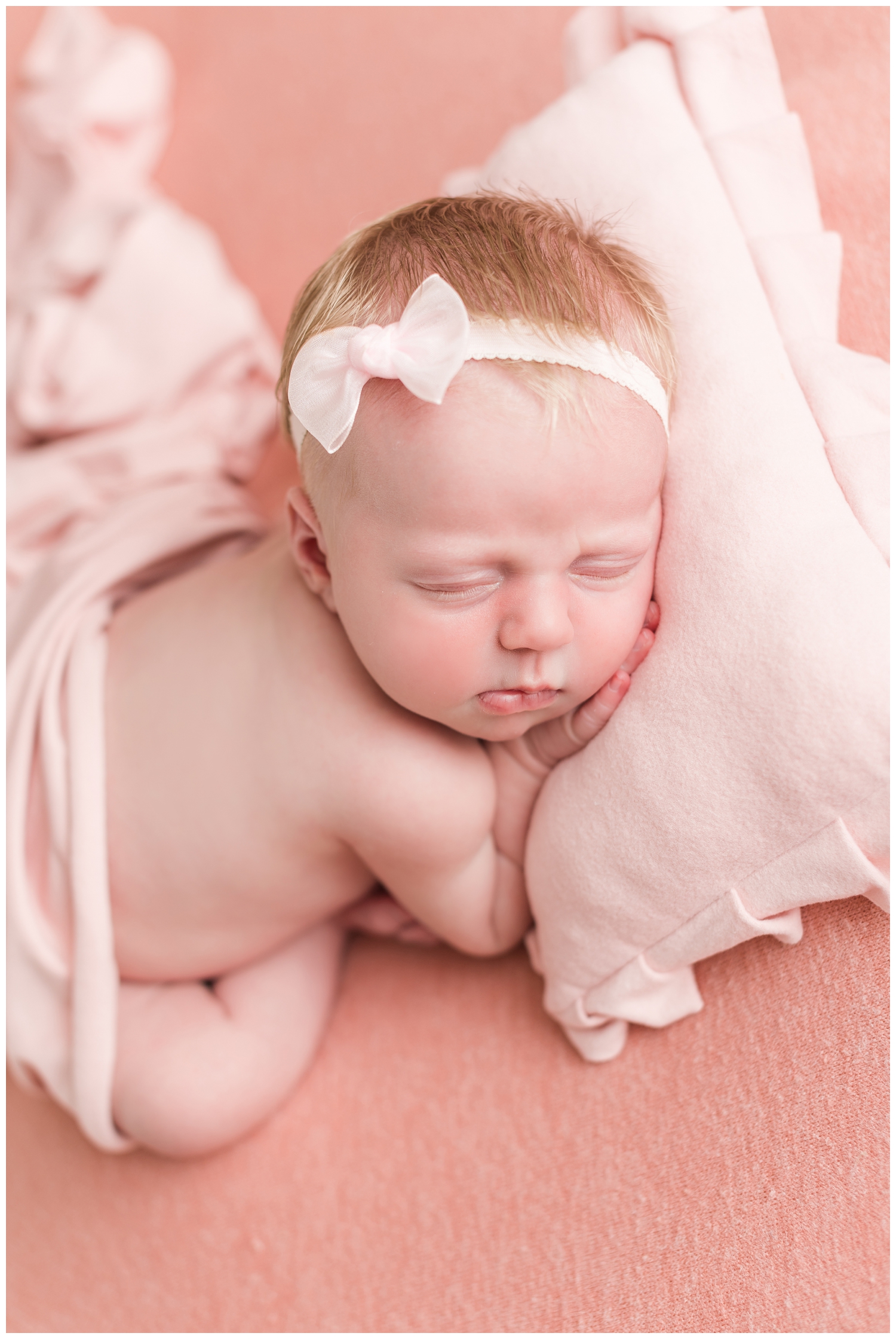 Baby Ryer pretty in pink and snuggled up in a taco pose | CB Studio