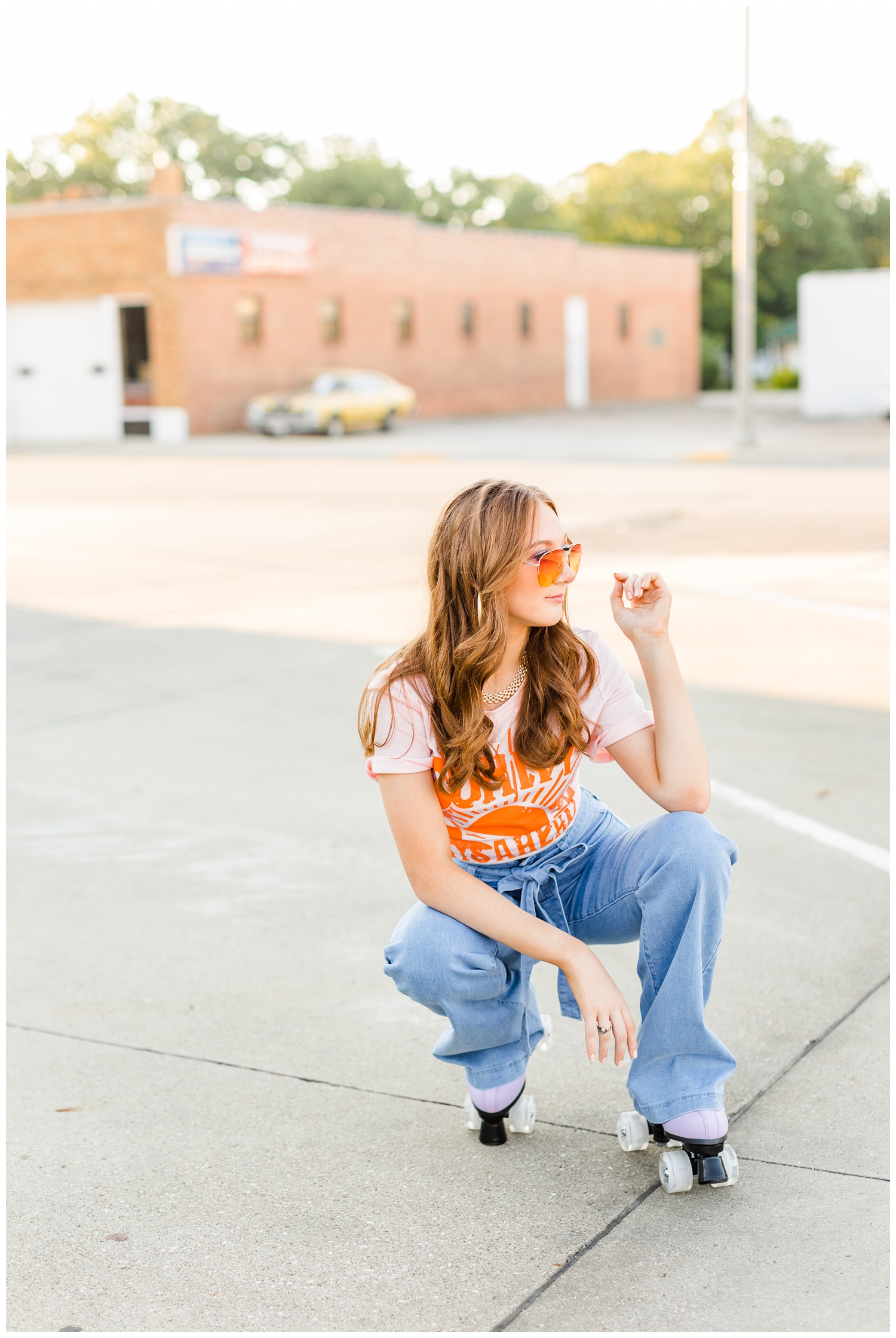 Savannah squats in a parking lot dressed in modern 70s style and roller skates | CB Studio 