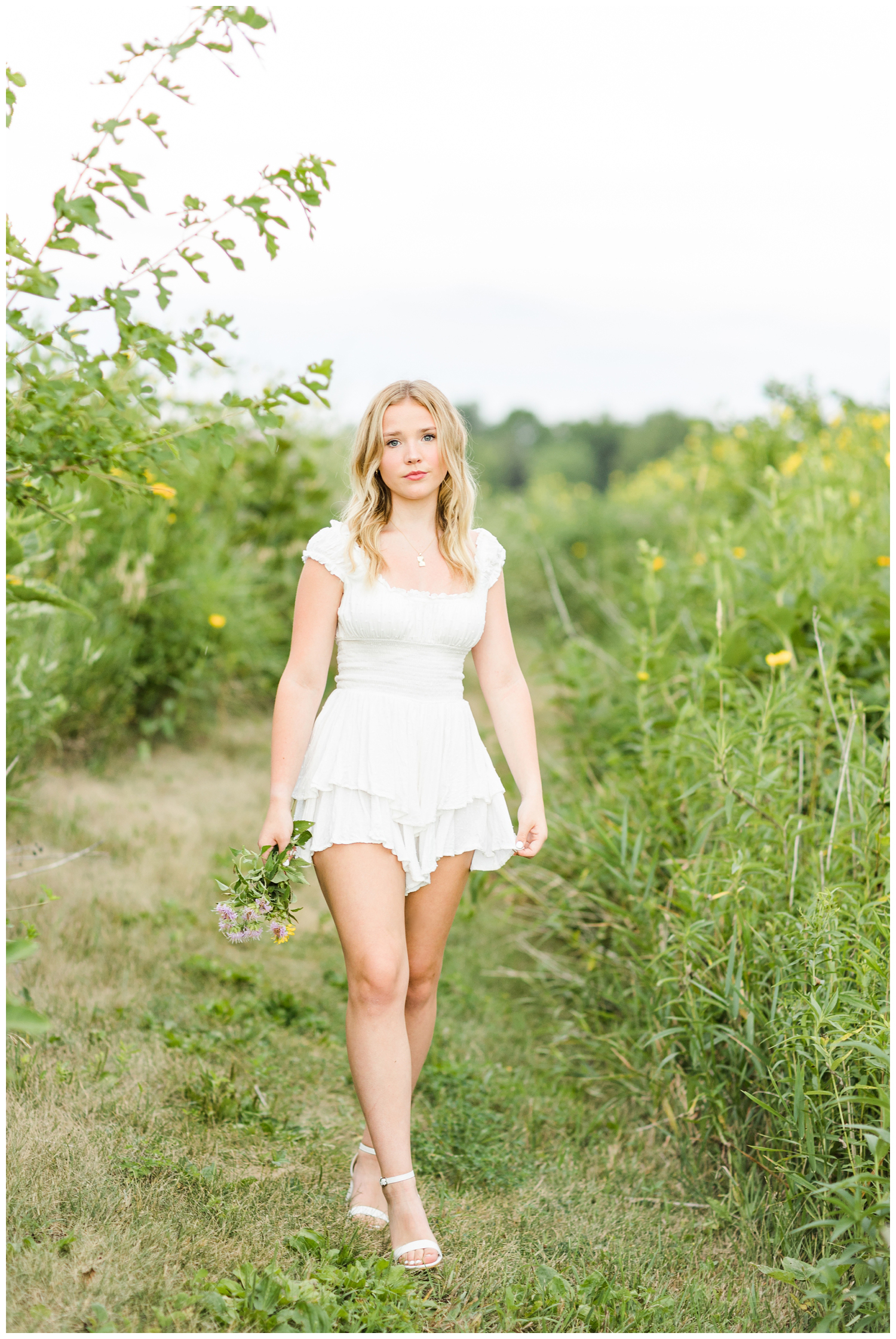 Cassie walks slowing through a field of wildflowers | CB Studio