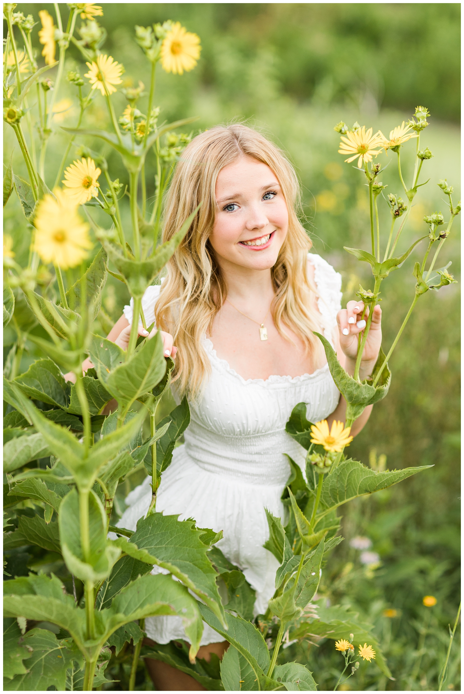 Cassie peeks through yellow flowers in a field of wildflowers | CB Studio