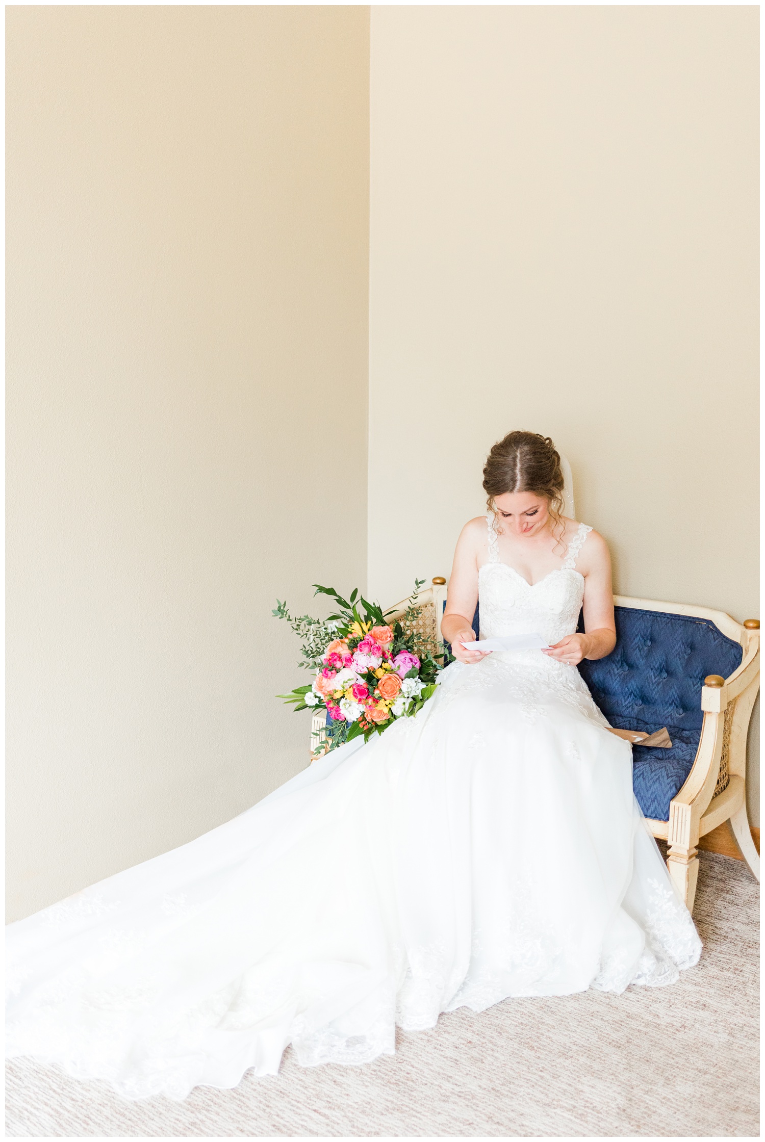 Leslie sits on an antique setae and reads a private letter from her groom as she gets ready for her wedding day | CB Studio