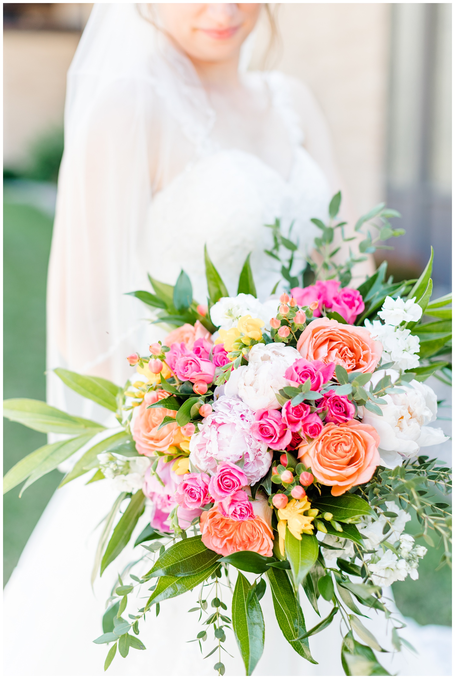 A pink, coral, white bridal bouquet with a touch of yellow, featuring garden roses, mini roses and peonies | CB Studio
